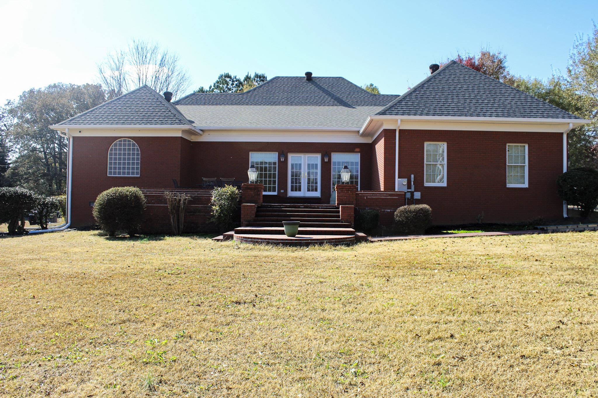 3070 Caney Branch Road Adamsville, TN 38310 - Photo 22 of 24 a front view of a house with a yard