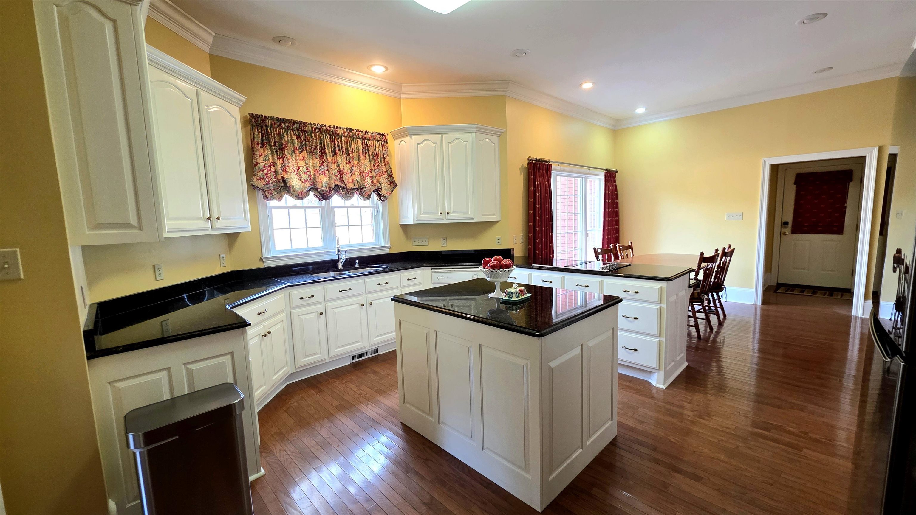 3070 Caney Branch Road Adamsville, TN 38310 - Photo 6 of 24 a kitchen with granite countertop a sink appliances and cabinets