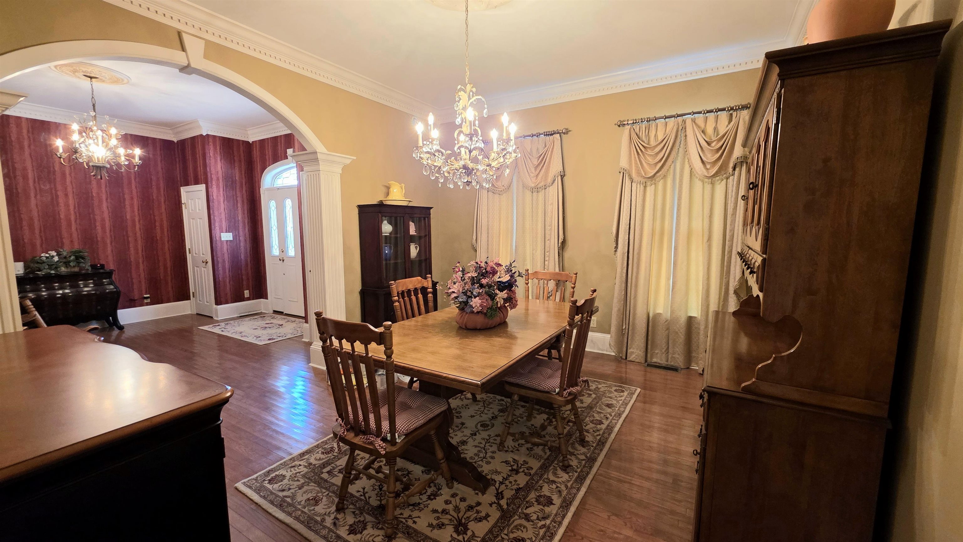 3070 Caney Branch Road Adamsville, TN 38310 - Photo 10 of 24 a view of a dining room with furniture and chandelier