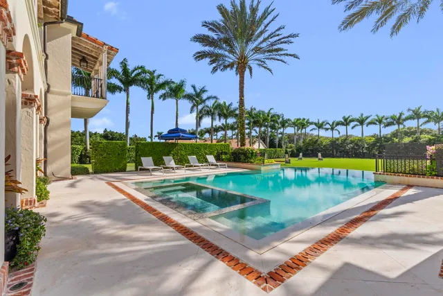 a view of a entryway door of the house with a potted plant
