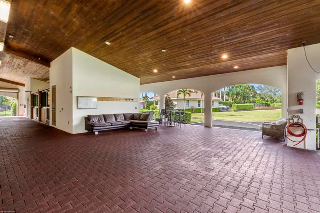 a view of a hallway with entryway wooden floor and front door