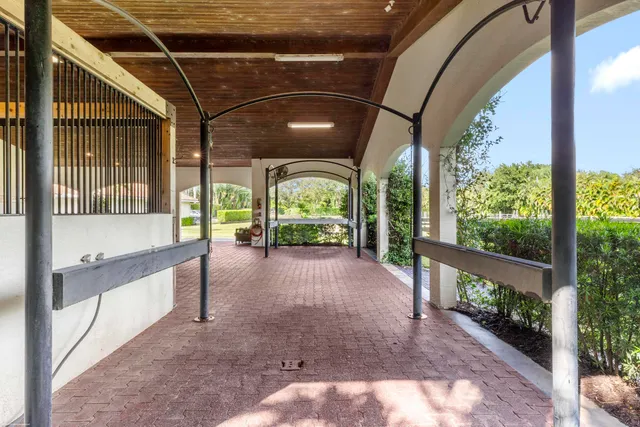 a living room with furniture and large windows