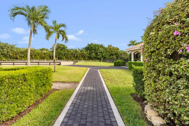 a bedroom with a large bed and a couch