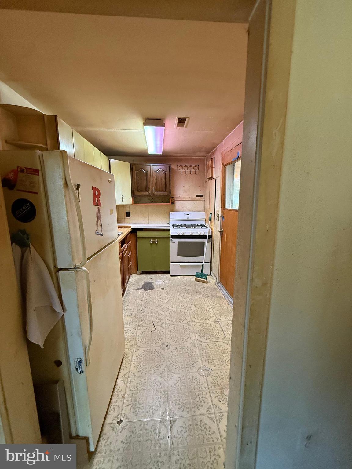 2136 Atco Avenue Atco, NJ 08004 - Photo 19 of 36 a kitchen with refrigerator a microwave and cabinets