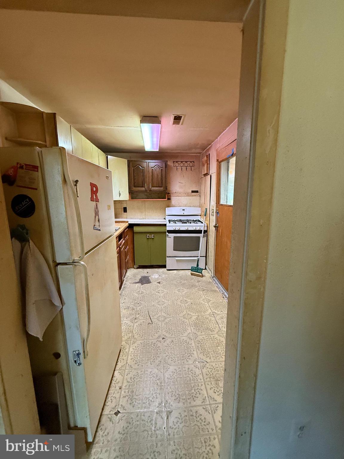 2136 Atco Avenue Atco, NJ 08004 - Photo 20 of 36 a kitchen with refrigerator a microwave and cabinets