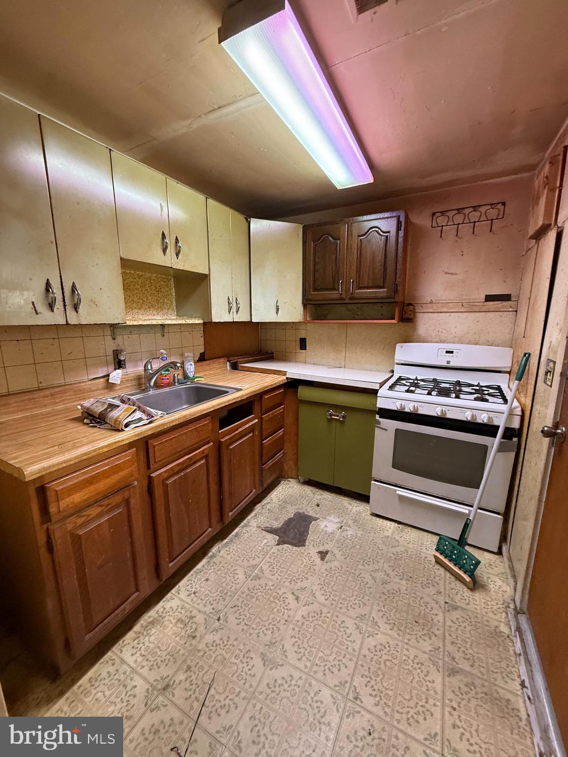 2136 Atco Avenue Atco, NJ 08004 - Photo 34 of 36 a kitchen with stainless steel appliances granite countertop a sink a stove and a refrigerator