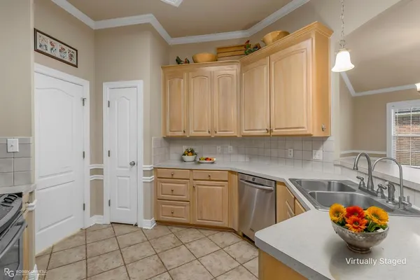 a bedroom with a large bed and potted plant