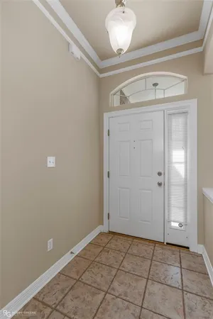 a view of a livingroom with an empty space and a fireplace