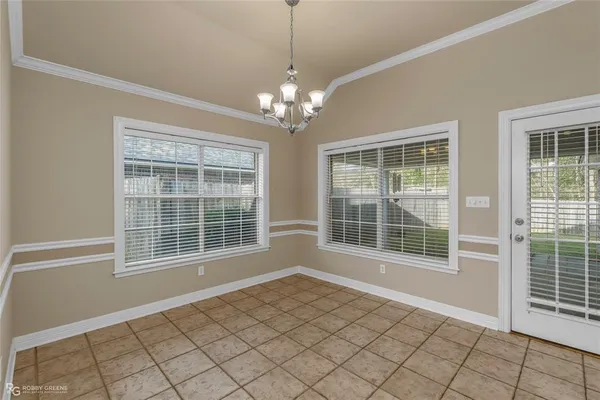 a kitchen with stainless steel appliances a stove a microwave and a refrigerator