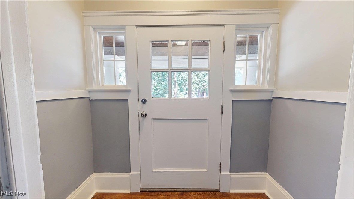 3174 Oak Road Cleveland, OH 44118 - Photo 2 of 33 Doorway to outside featuring baseboards and wood finished floors