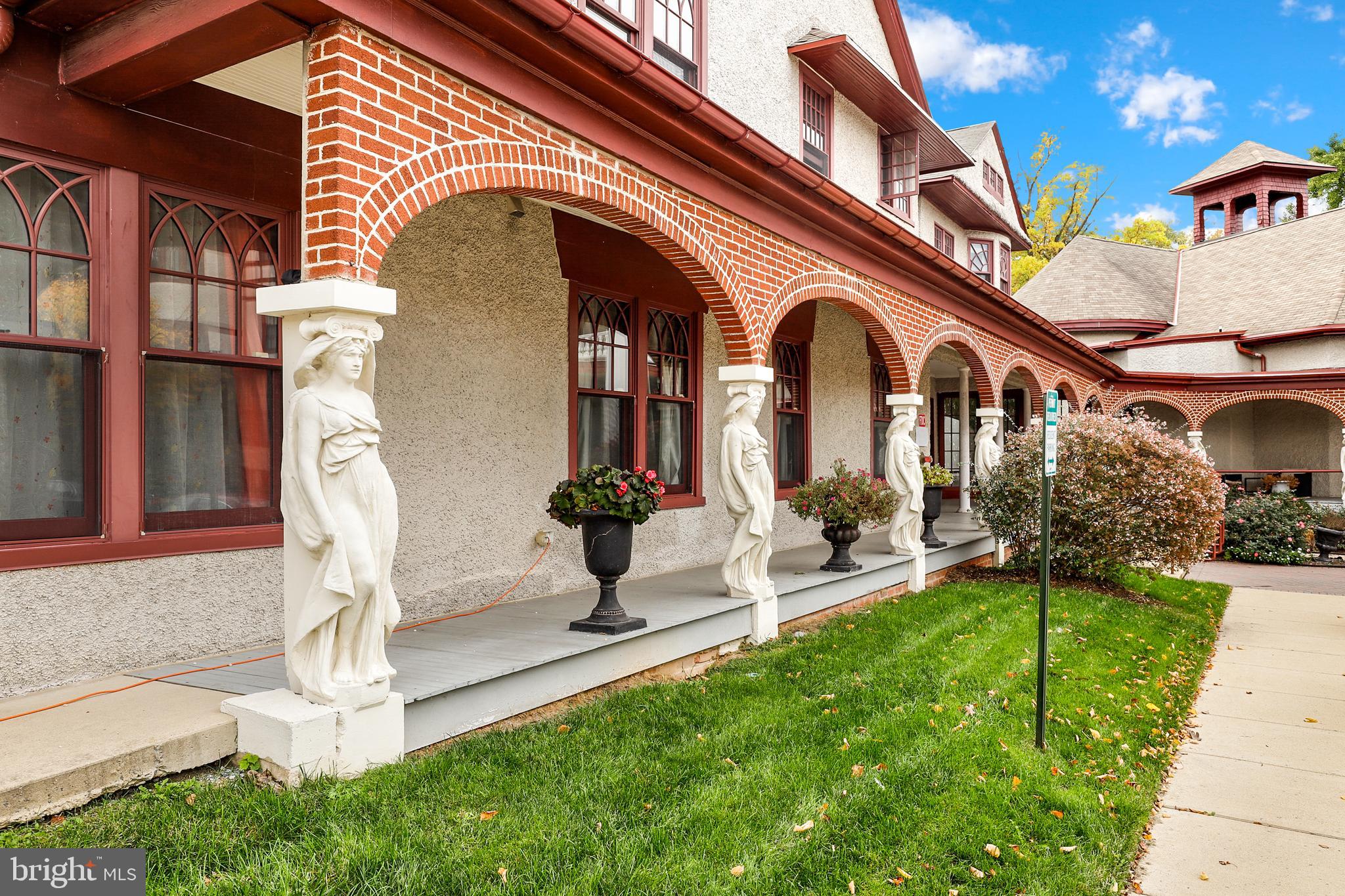 9610 Dewitt Drive, Unit SH205 Silver Spring, MD 20910 - Photo 56 of 59 a front view of a house with a garden
