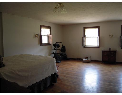 622 Boyers Road Boyers, PA 16020 - Photo 9 of 18 Master Bedroom. L shaped bedroom with sitting area and hardwood floors.