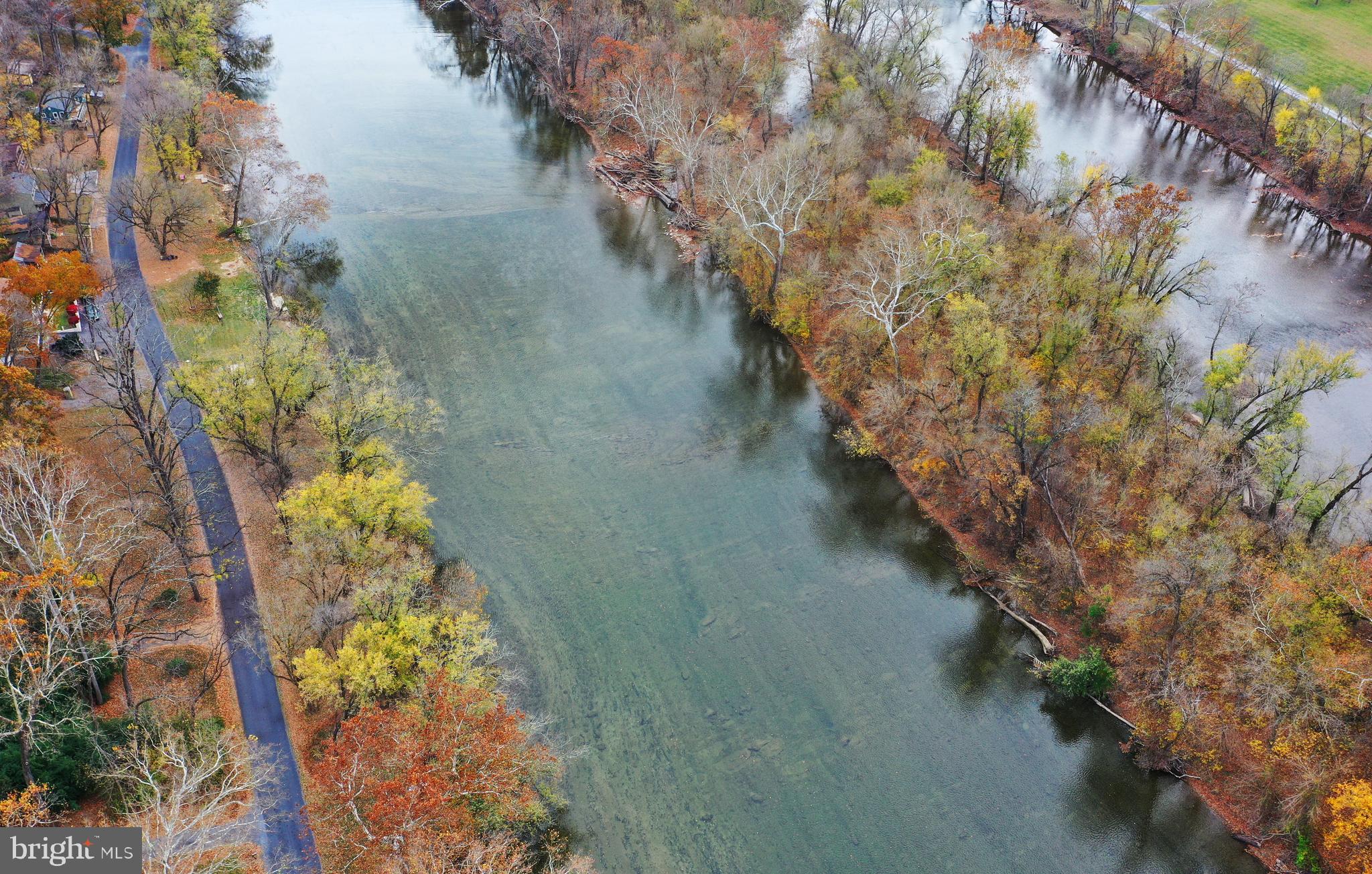 Lot D Lockes Mill Road Berryville, VA 22611 - Photo 2 of 29 a view of a lake with beach and trees