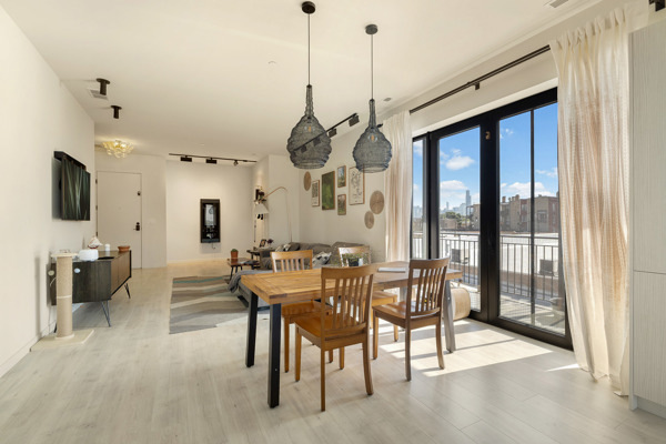 2135 West Cermak Road, Unit 3S Chicago, IL 60608 - Photo 6 of 14 a view of a dining room with furniture window and wooden floor