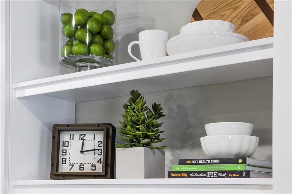 6919 Peachtree Dunwoody Road, Unit 131 Sandy Springs, GA 30328 - Photo 12 of 43 a vase of flowers sitting on a table