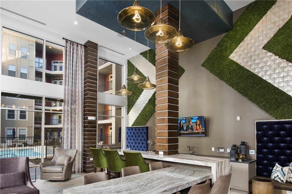 6919 Peachtree Dunwoody Road, Unit 131 Sandy Springs, GA 30328 - Photo 25 of 43 a view of living room kitchen and entryway