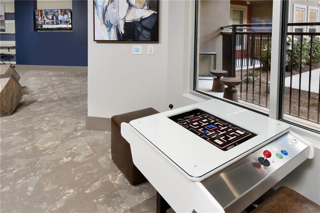 6919 Peachtree Dunwoody Road, Unit 131 Sandy Springs, GA 30328 - Photo 30 of 43 a white cabinet with a black white and white wall
