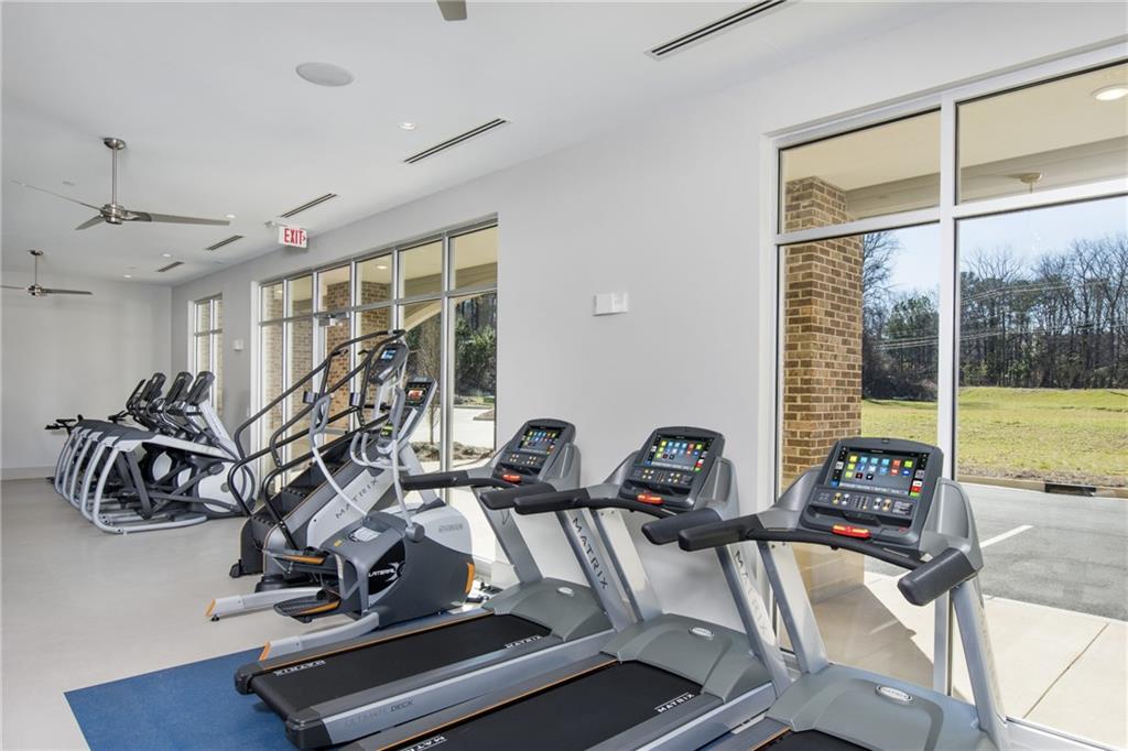 6919 Peachtree Dunwoody Road, Unit 131 Sandy Springs, GA 30328 - Photo 40 of 43 a view of a room with gym equipment