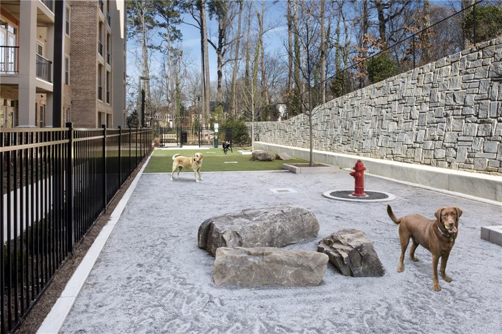6919 Peachtree Dunwoody Road, Unit 131 Sandy Springs, GA 30328 - Photo 42 of 43 a view of a swimming pool with a patio
