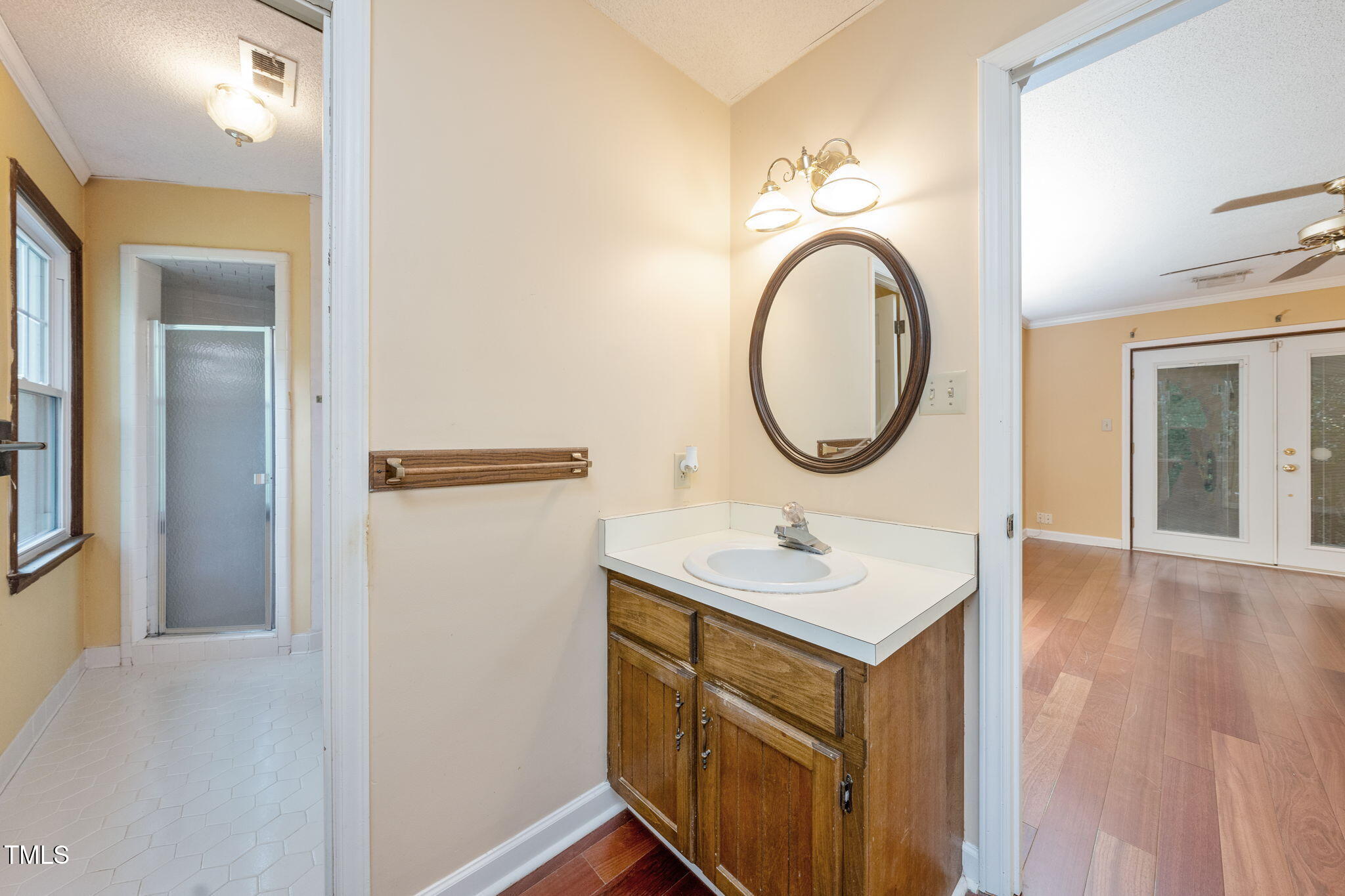 6221 Rushingbrook Drive Raleigh, NC 27612 - Photo 20 of 30 a bathroom with a sink and a mirror