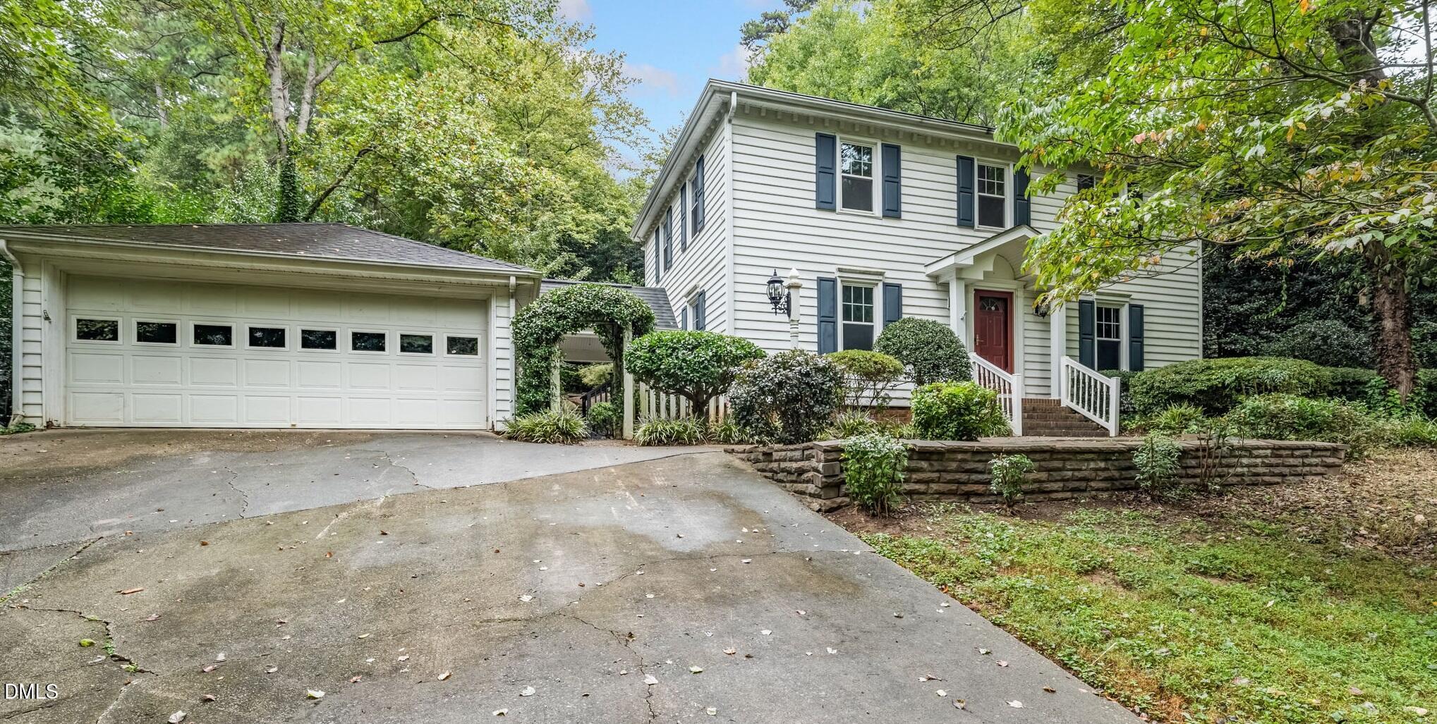 6221 Rushingbrook Drive Raleigh, NC 27612 - Photo 2 of 30 a house with trees in the background