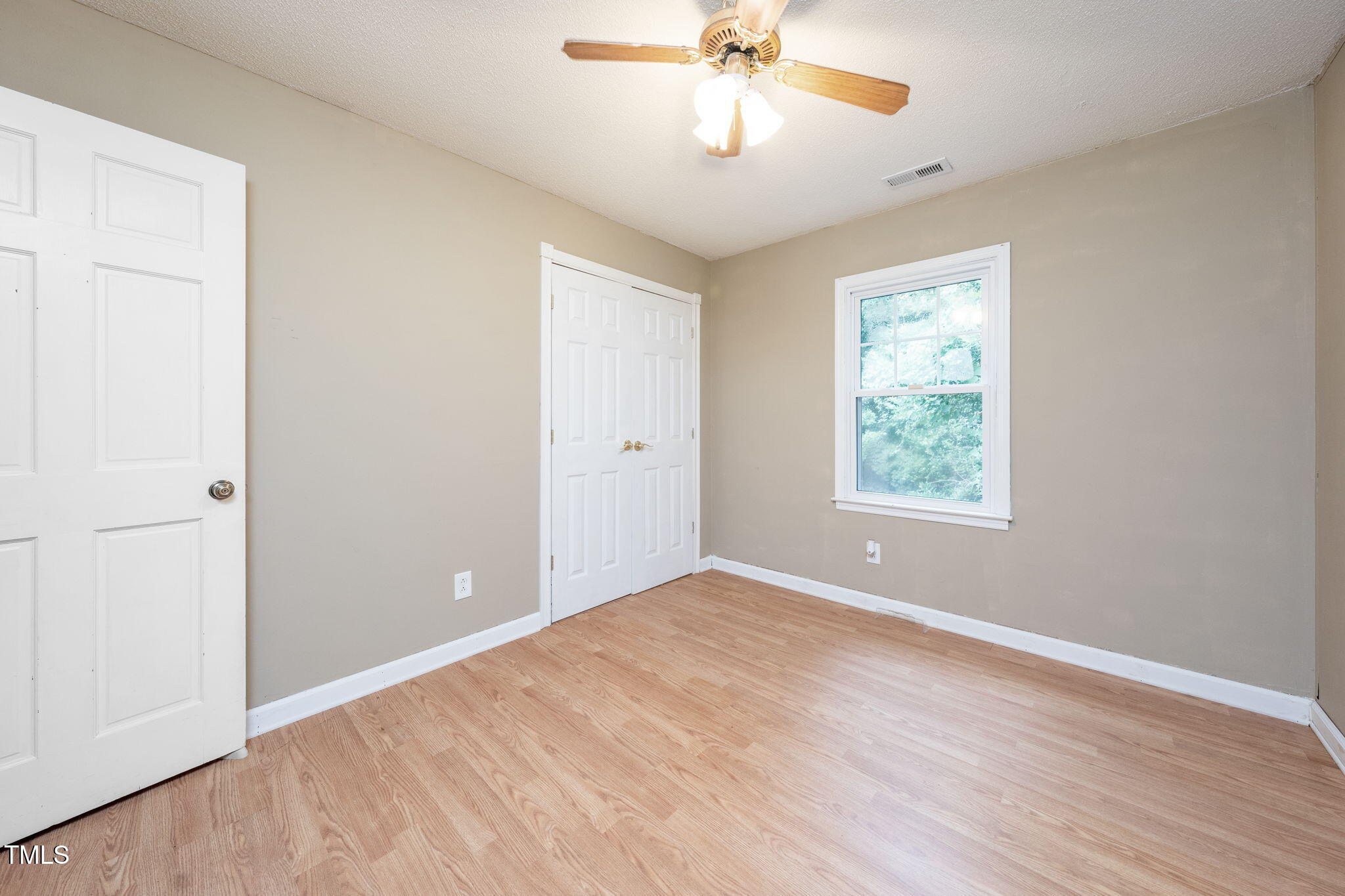 6221 Rushingbrook Drive Raleigh, NC 27612 - Photo 22 of 30 wooden floor in an empty room with a window