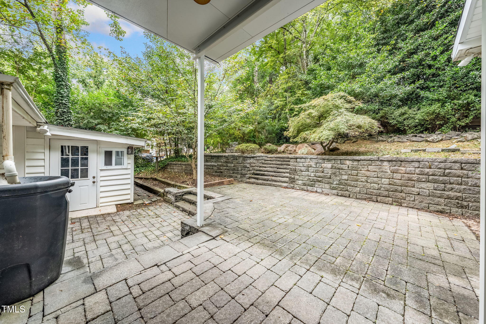 6221 Rushingbrook Drive Raleigh, NC 27612 - Photo 28 of 30 a view of house with backyard and sitting area