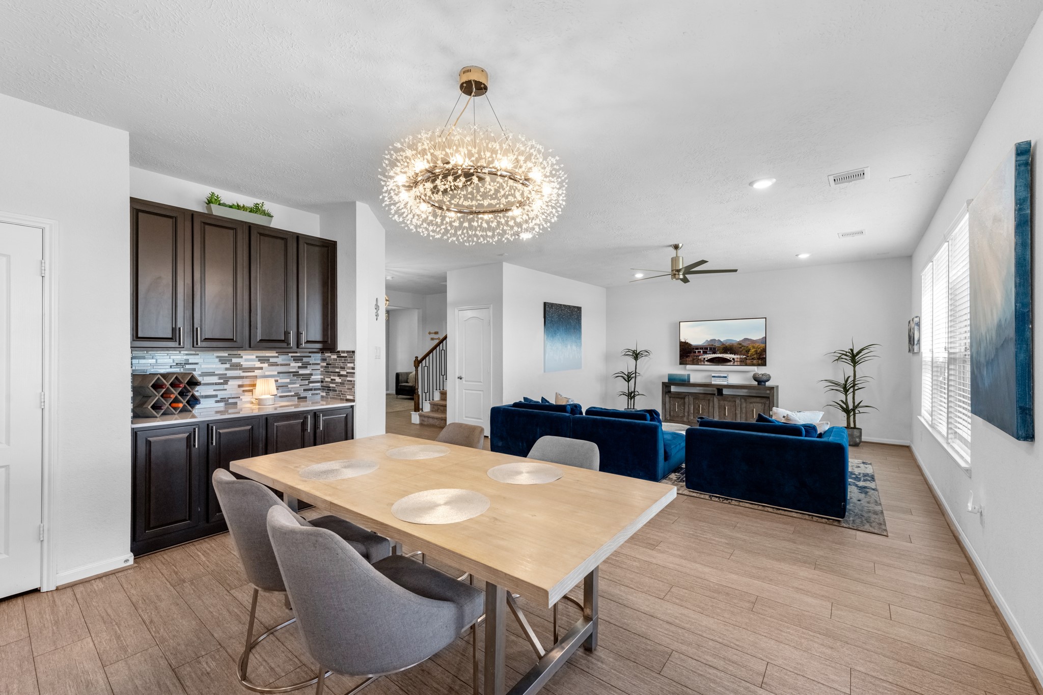 5126 Avondale Rise Street Katy, TX 77493 - Photo 13 of 28 Dining space open to the family room, creating an inviting and functional gathering area.