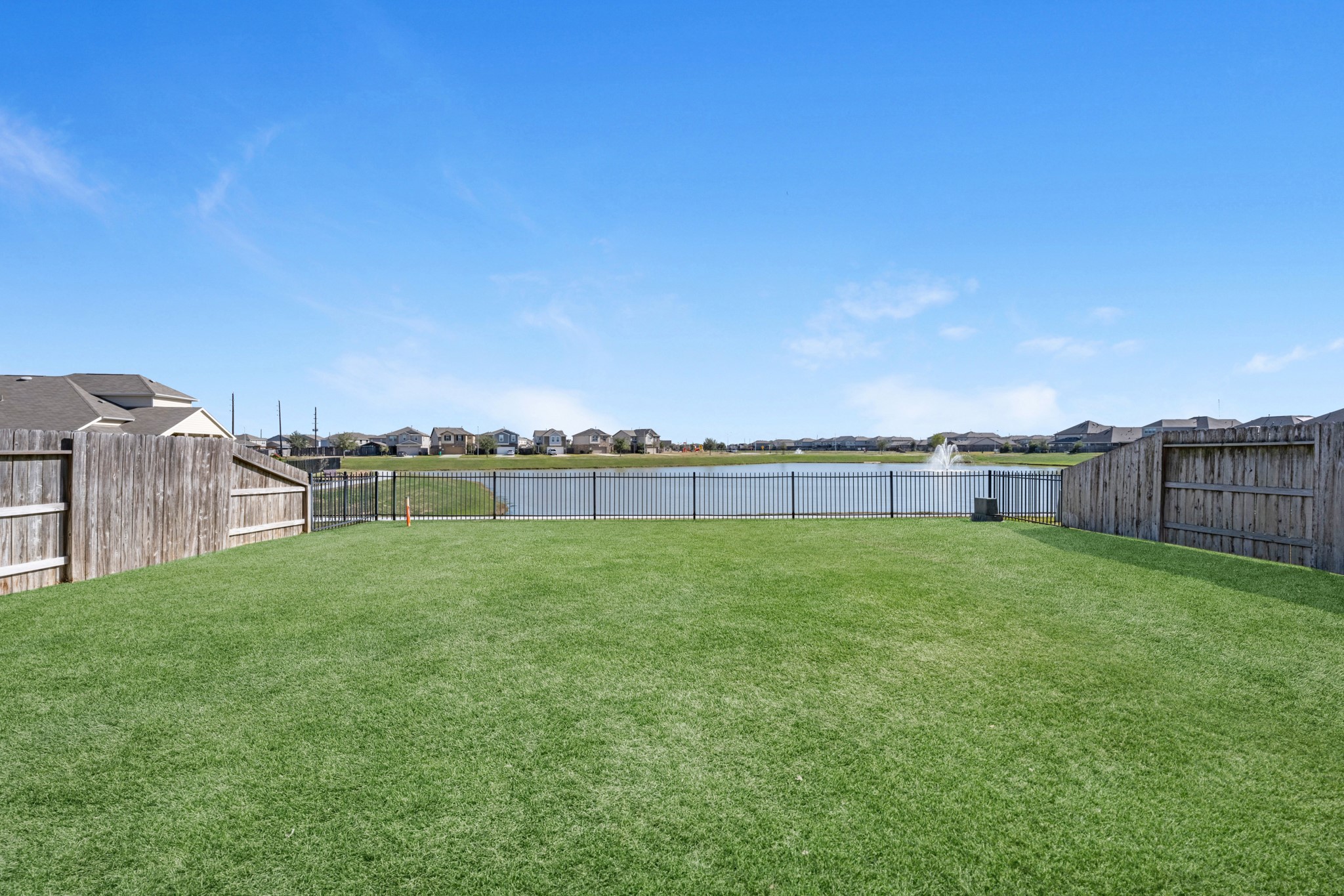 5126 Avondale Rise Street Katy, TX 77493 - Photo 25 of 28 Large backyard offering open space and scenic views of the community lake.