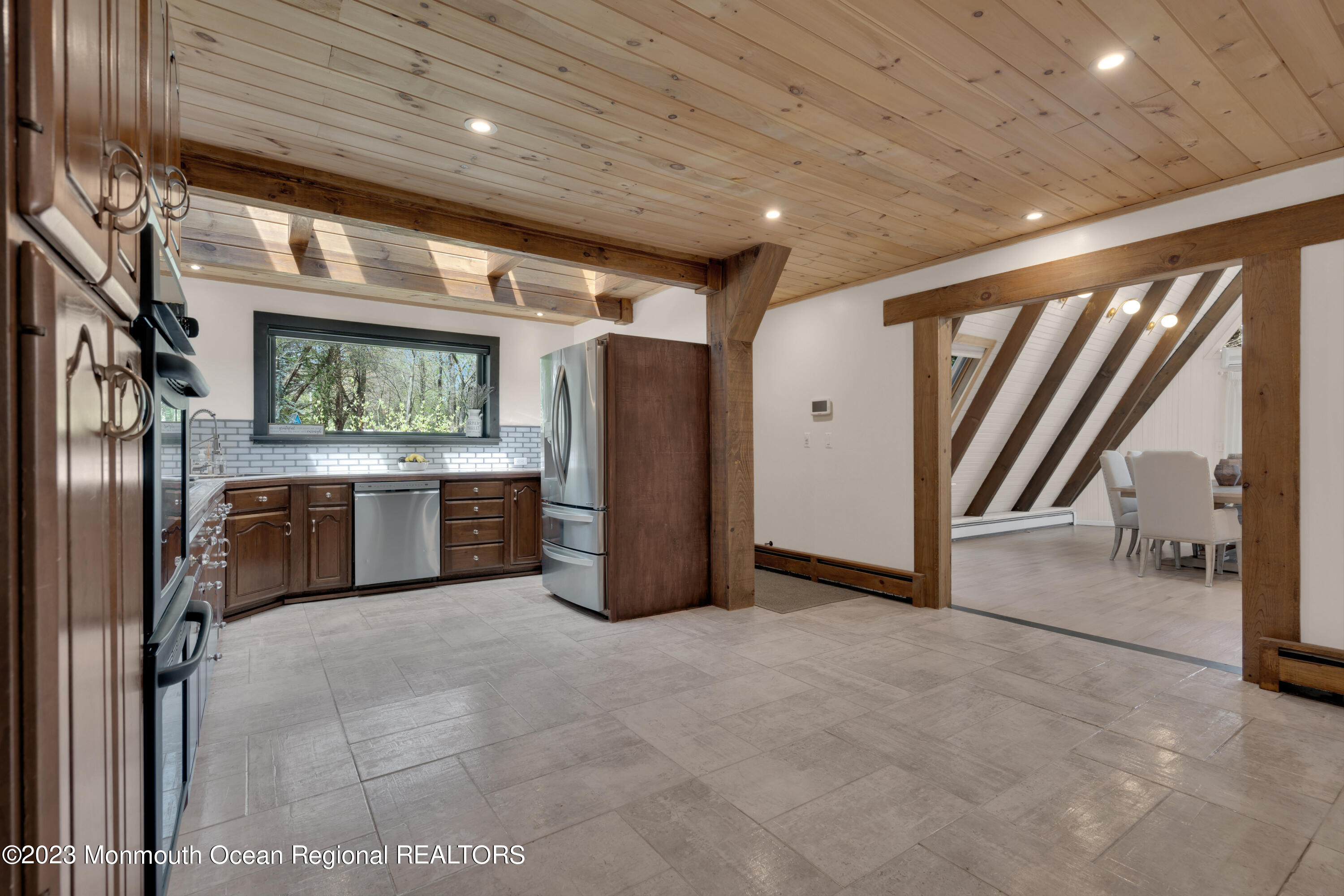 649 Hyson Road Jackson, NJ 08527 - Photo 19 of 67 a view of a hallway with stainless steel appliances granite countertop furniture