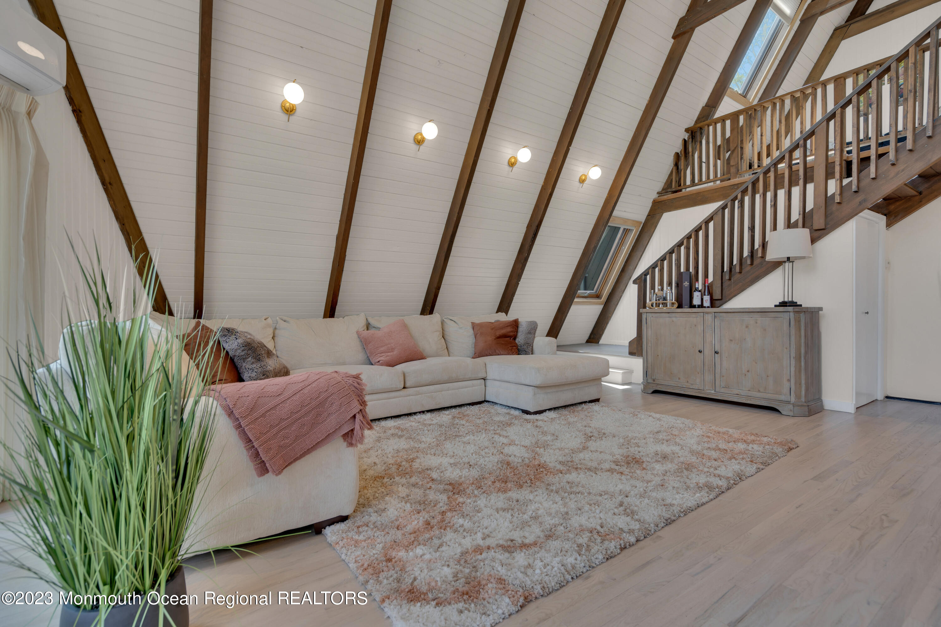 649 Hyson Road Jackson, NJ 08527 - Photo 36 of 67 a living room with furniture and a chandelier