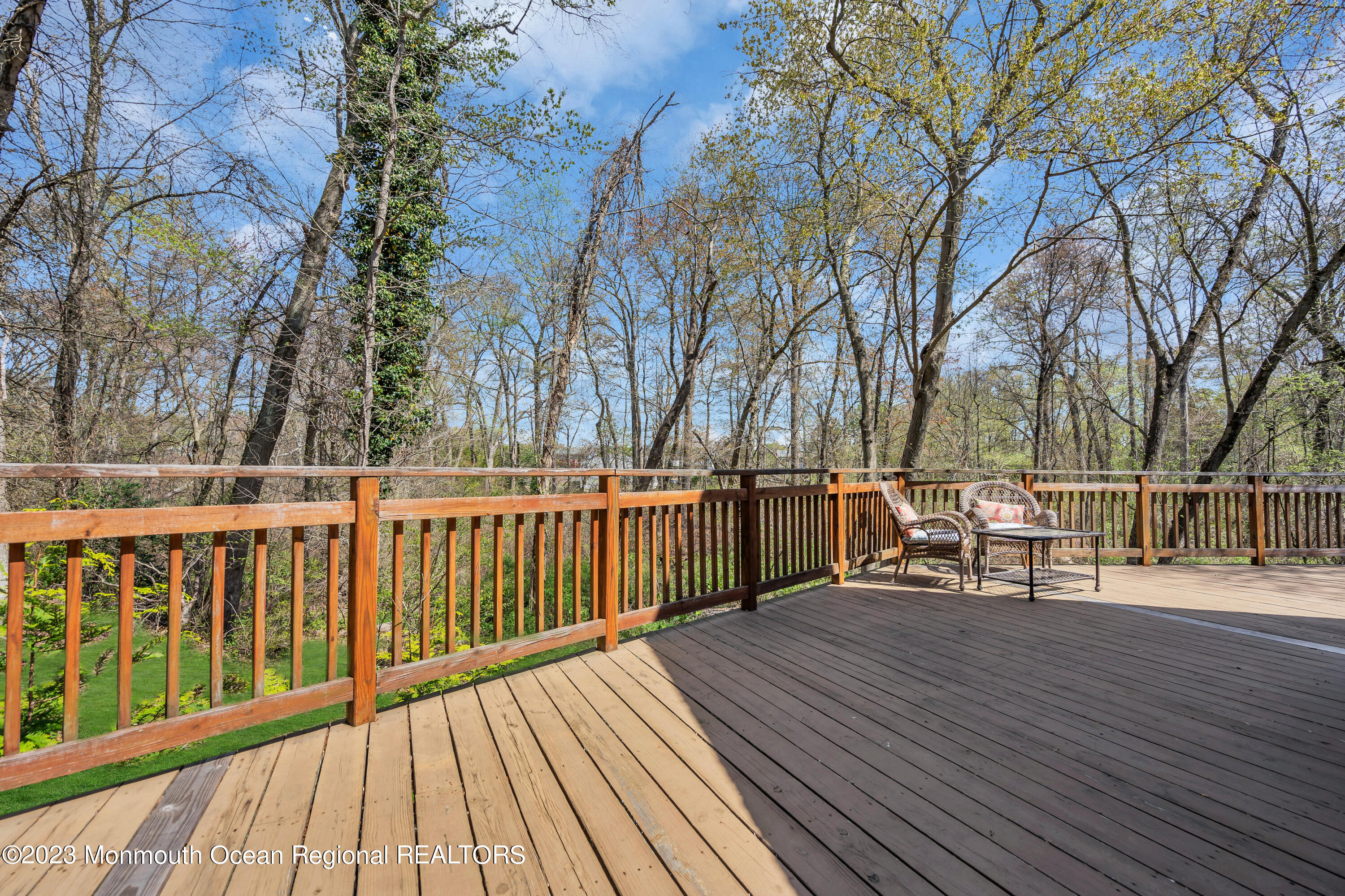 649 Hyson Road Jackson, NJ 08527 - Photo 54 of 67 a view of a deck with table and chairs and wooden fence