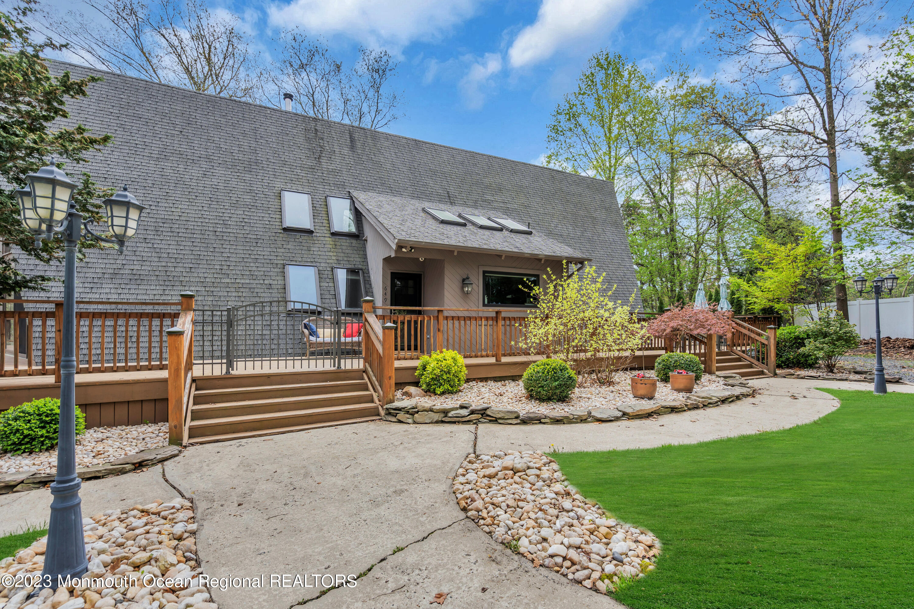 649 Hyson Road Jackson, NJ 08527 - Photo 9 of 67 a view of a house with backyard sitting area and garden