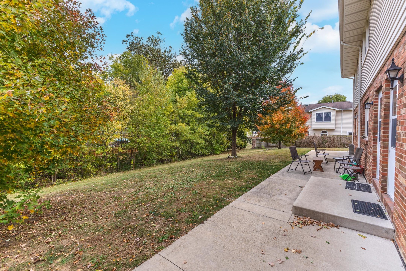 105 East Lincoln Street, Unit K Normal, IL 61761 - Photo 11 of 35 a view of a backyard with sitting area