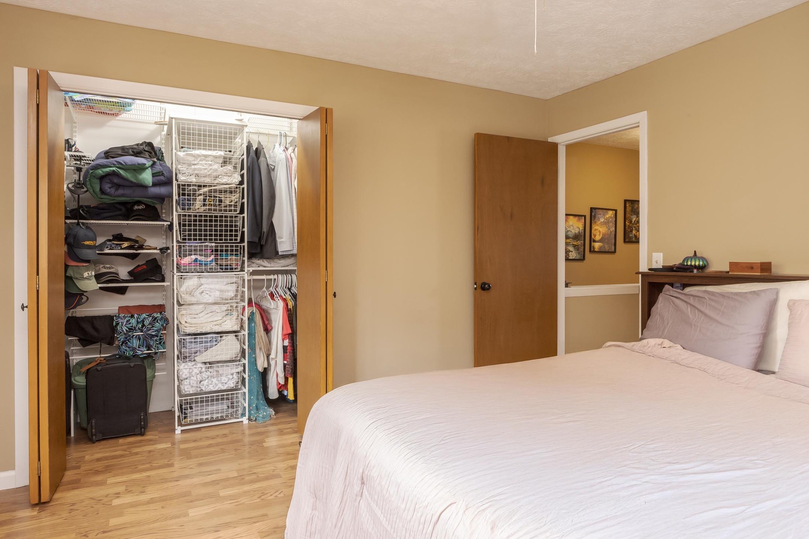 105 East Lincoln Street, Unit K Normal, IL 61761 - Photo 14 of 35 a bedroom with a bed and a walk in closet