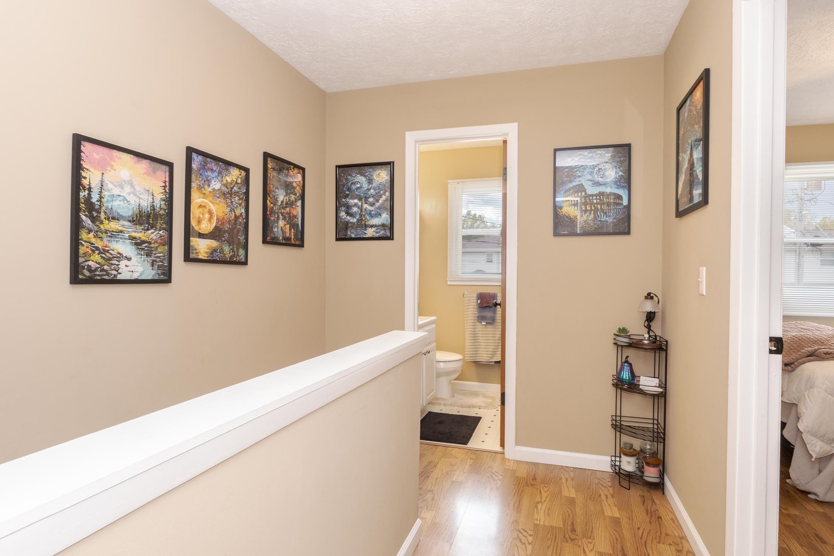 105 East Lincoln Street, Unit K Normal, IL 61761 - Photo 15 of 35 a view of a hallway with wooden floor and a living room