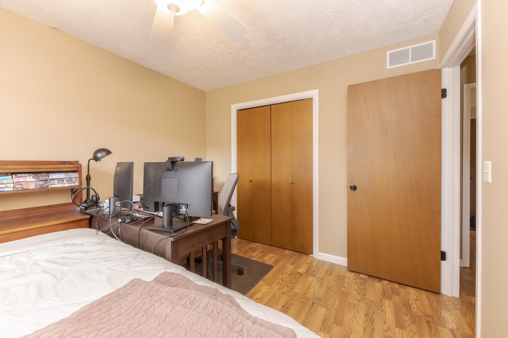 105 East Lincoln Street, Unit K Normal, IL 61761 - Photo 17 of 35 a bed room with two beds and a chair