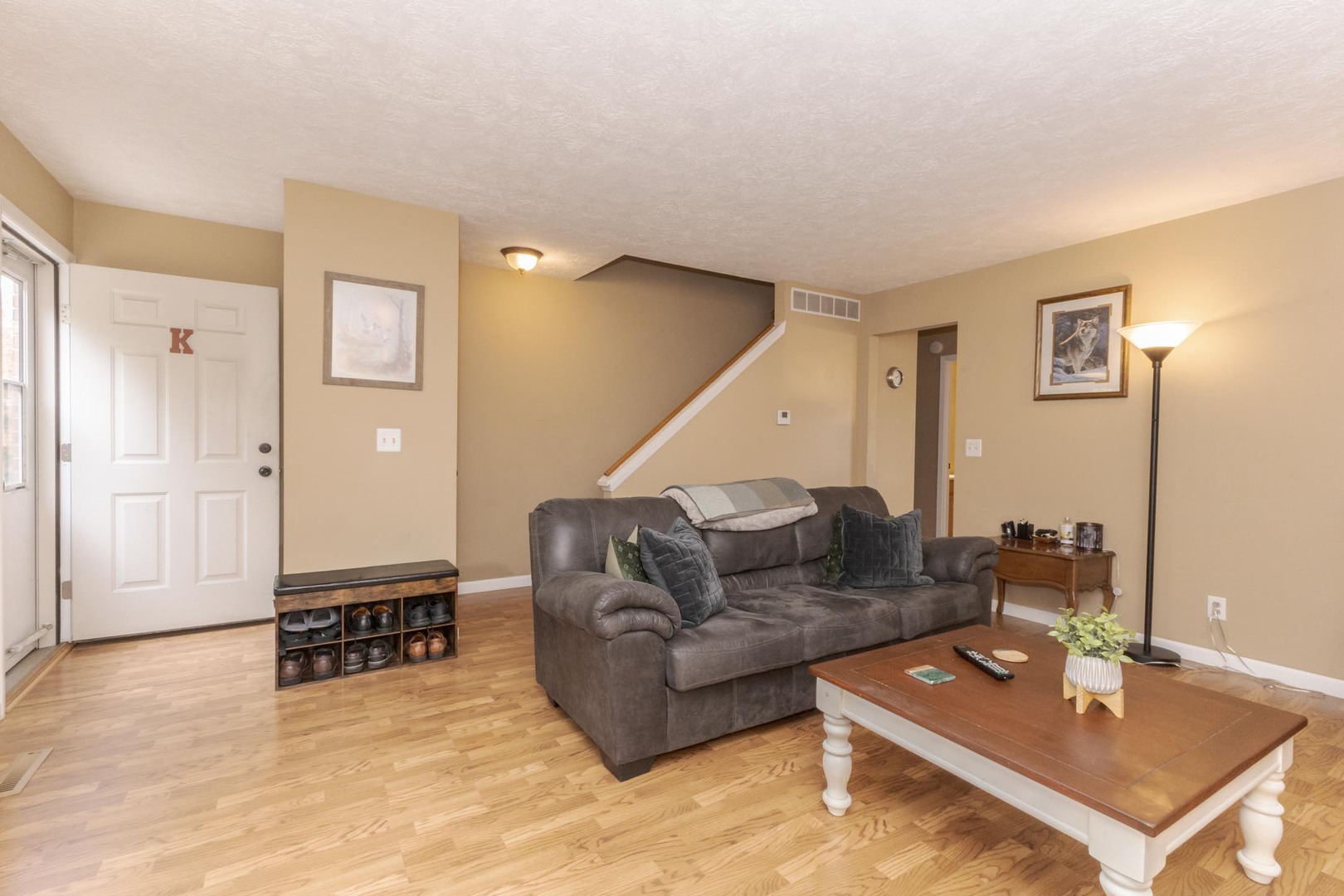 105 East Lincoln Street, Unit K Normal, IL 61761 - Photo 24 of 35 a living room with furniture and a table