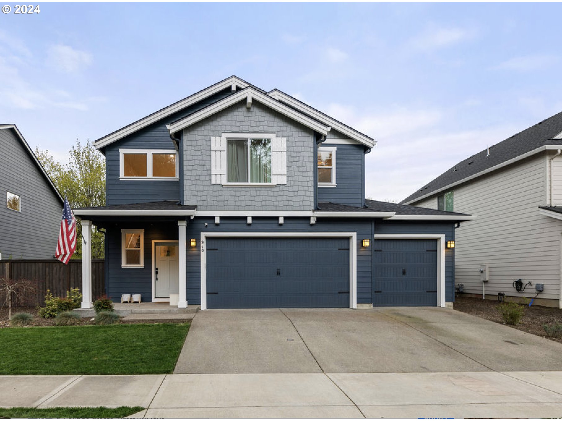 940 South Sevier Road Ridgefield, WA 98642 - Photo 1 of 21 a front view of a house with a yard and garage