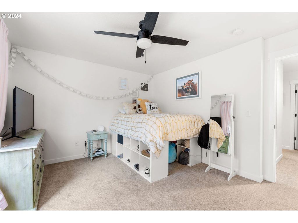 940 South Sevier Road Ridgefield, WA 98642 - Photo 11 of 21 a bedroom with a bed and a flat screen tv