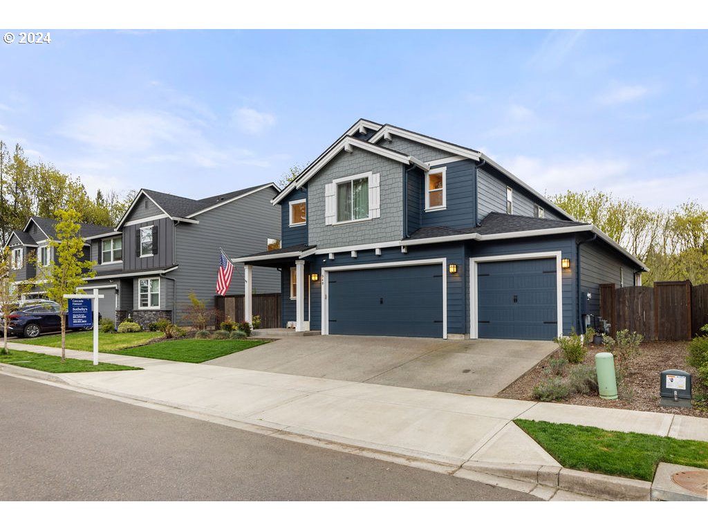 940 South Sevier Road Ridgefield, WA 98642 - Photo 21 of 21 a front view of a house with a yard and garage