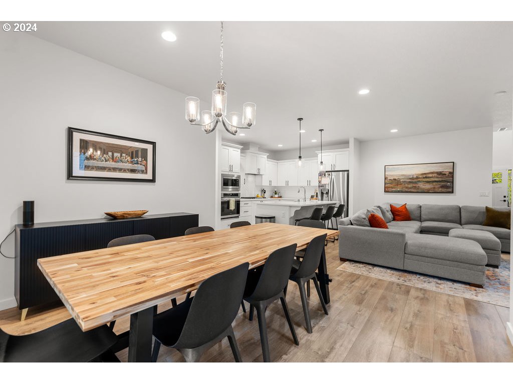 940 South Sevier Road Ridgefield, WA 98642 - Photo 6 of 21 a view of a dining room with furniture and wooden floor