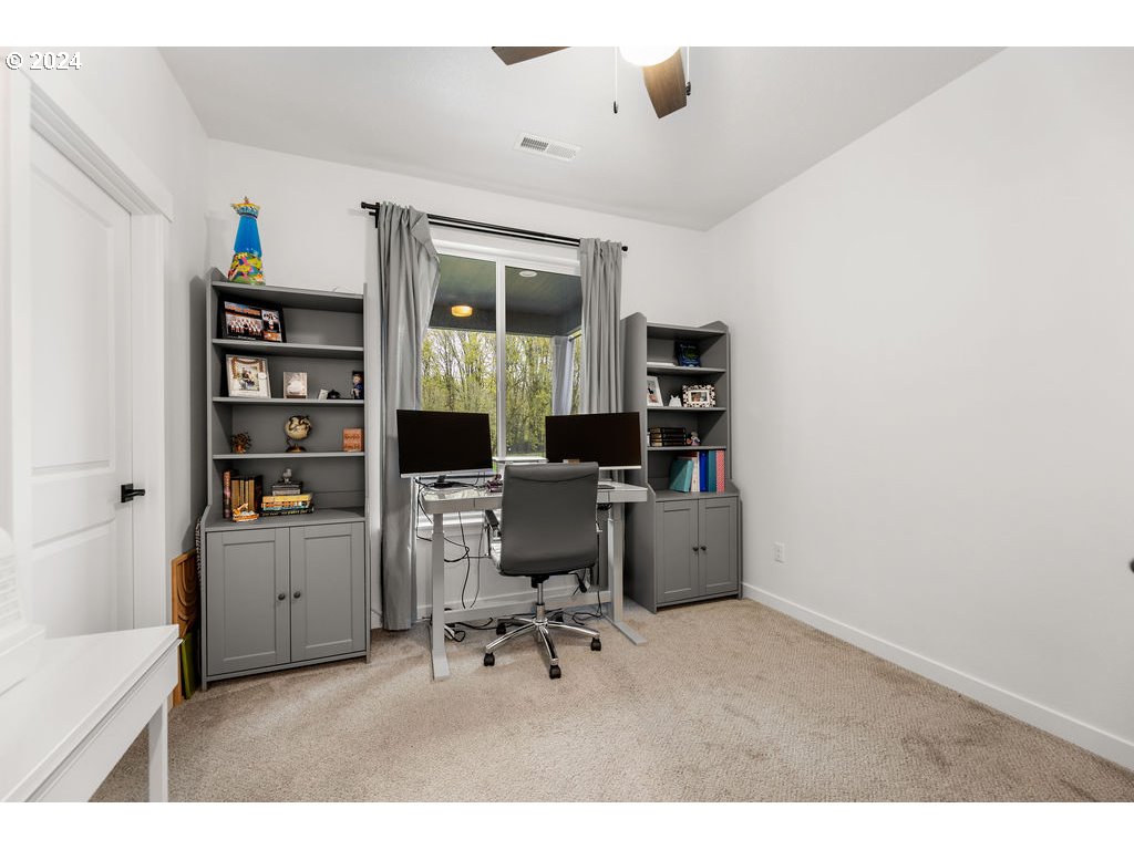 940 South Sevier Road Ridgefield, WA 98642 - Photo 9 of 21 a workspace with furniture and wooden floor