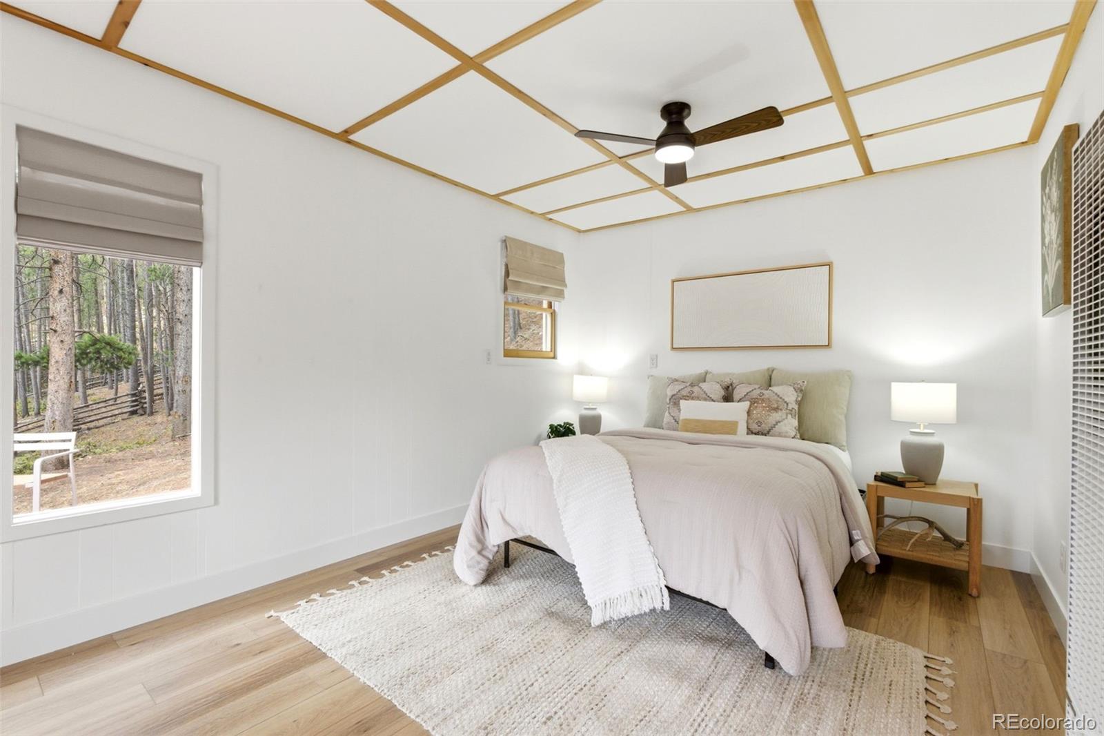 154 Apache Road Evergreen, CO 80439 - Photo 17 of 30 a bedroom with a bed and a window
