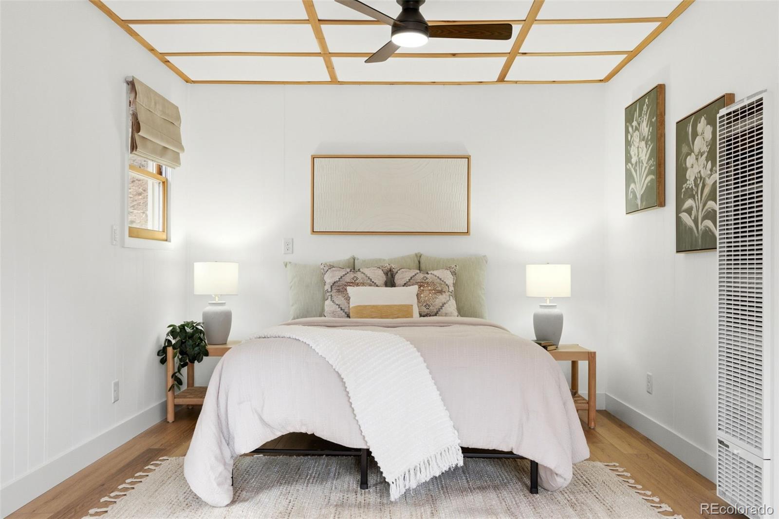 154 Apache Road Evergreen, CO 80439 - Photo 5 of 30 a bedroom with a bed and a potted plant