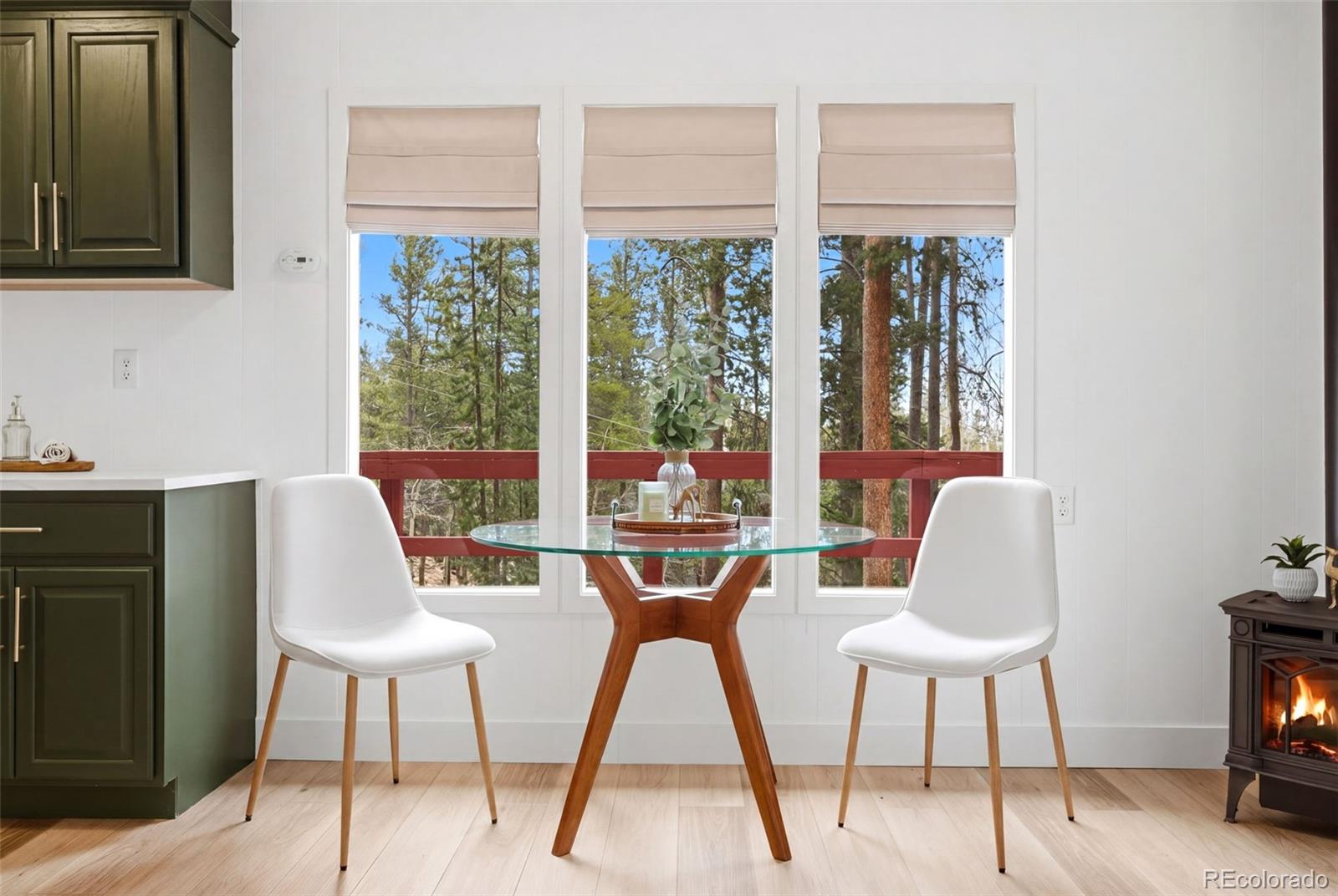 154 Apache Road Evergreen, CO 80439 - Photo 7 of 30 a view of a dining room with furniture window and outside view
