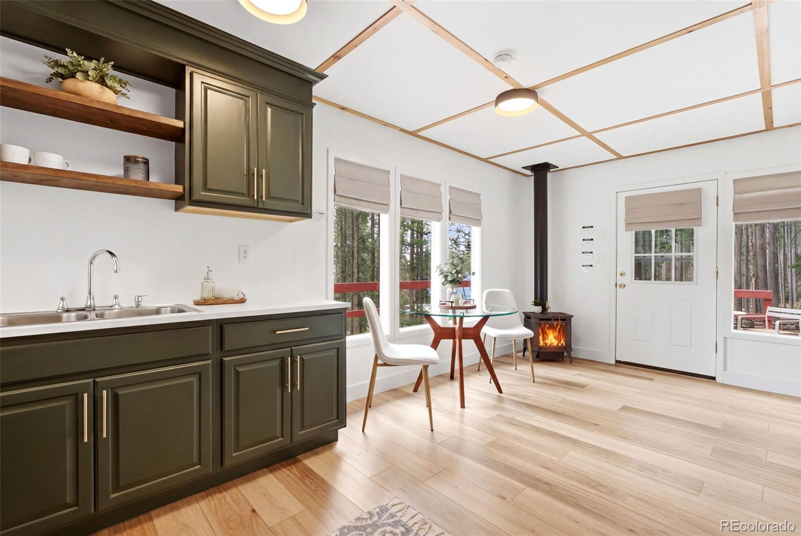 154 Apache Road Evergreen, CO 80439 - Photo 8 of 30 a view of a kitchen with chair and table in it