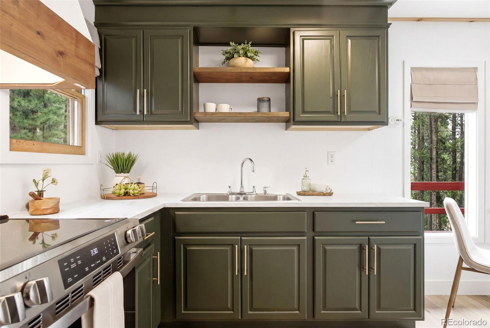 154 Apache Road Evergreen, CO 80439 - Photo 10 of 30 a kitchen with a sink and cabinets