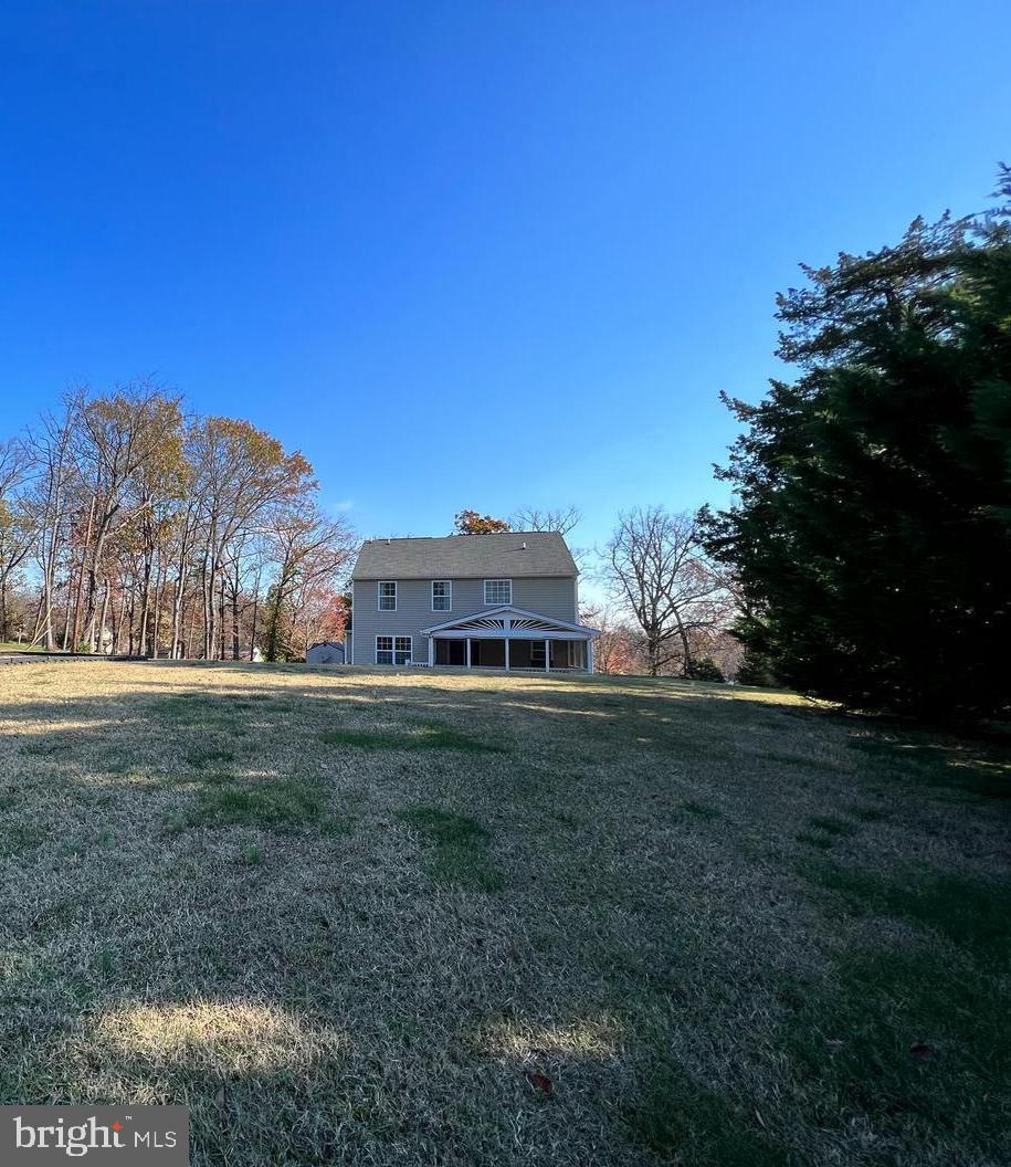 5870 Deer Ridge Lane Elkridge, MD 21075 - Photo 6 of 55 View of house from rear almost 2/3 acre