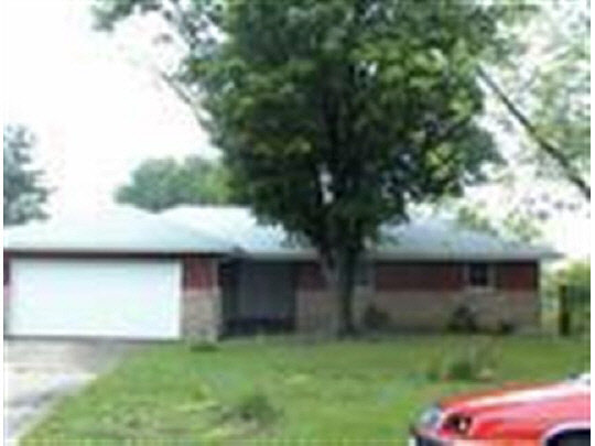 4607 Manheim Road Rockford, IL 61108 - Photo 1 of 1 a view of a yard in front of a house with a large tree